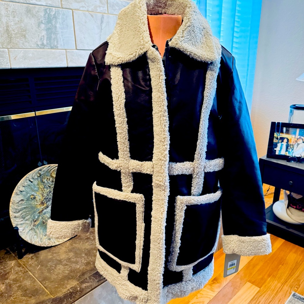 Levi's womens Long Faux Leather Jacket With Faux Sherpa. 
You will be warm.